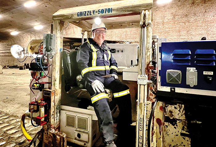 Editor of the World-Spectator Kevin Weedmark sitting in the grizzly miner underground at the mine site in Rocanville. The grizzly is one of the original mining machines at Rocanville. <br />